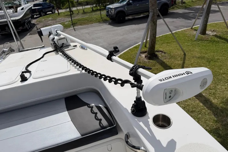 Slide: The Image of 2021 Twin Vee 310 CC GF boat with Minn Kota trolling motor on deck. - 9