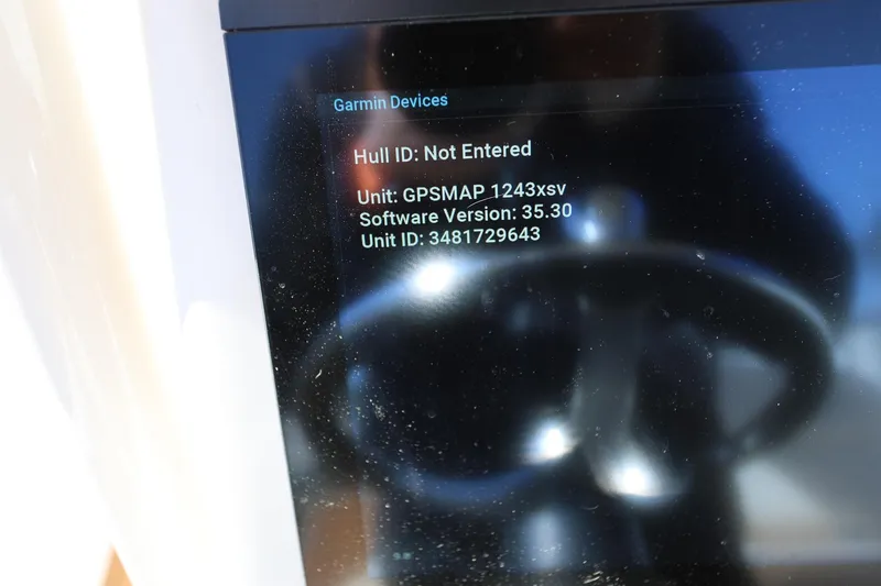 Slide: The Image of Garmin device display on 2024 Grady-White 251 Coastal Explorer boat, showing GPSMAP details. - 13