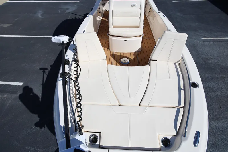 Slide: The Image of 2024 Grady-White 251 Coastal Explorer boat interior with cushioned seating and teak flooring. - 27