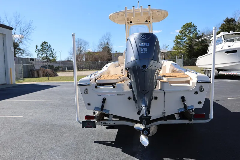 Slide: The Image of 2024 Grady-White 251 Coastal Explorer boat with Yamaha 300 V6 engine, parked outdoors. - 3