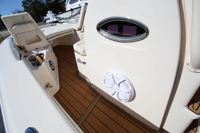 Slide: The Image of 2024 Grady-White 251 Coastal Explorer boat interior with seating and speaker. - 30