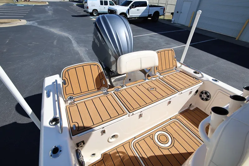Slide: The Image of 2024 Grady-White 251 Coastal Explorer boat interior with teak flooring and Yamaha engine. - 7