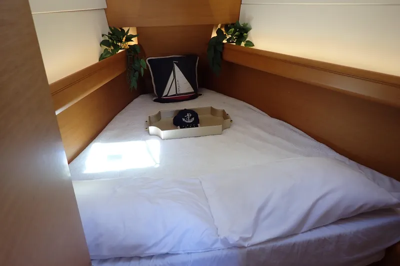 Slide: The Image of Cozy cabin interior of 2018 Jeanneau Sun Odyssey 389 with nautical decor and bedding. - 10