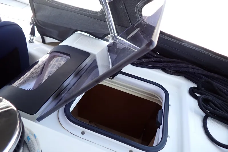 Slide: The Image of Open hatch on 2018 Jeanneau Sun Odyssey 389 sailboat, showcasing deck details and ropes. - 102