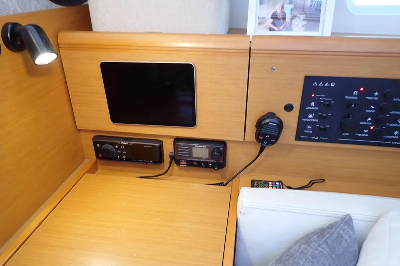 Slide: The Image of Interior of 2018 Jeanneau Sun Odyssey 389 yacht with navigation equipment and control panel. - 114
