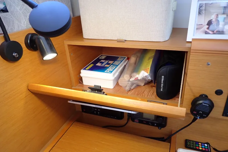 Slide: The Image of Interior of 2018 Jeanneau Sun Odyssey 389 with first aid kit and storage compartment. - 117
