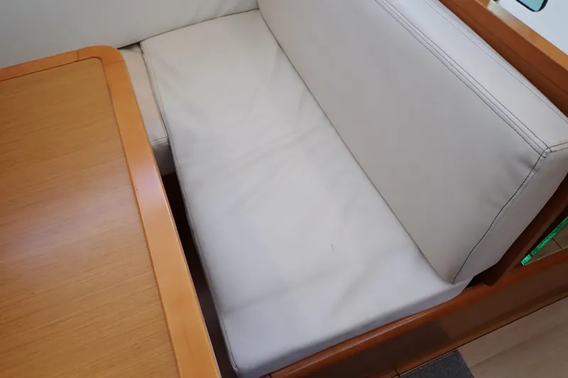 Slide: The Image of Interior seating of 2018 Jeanneau Sun Odyssey 389 yacht with wooden table. - 134