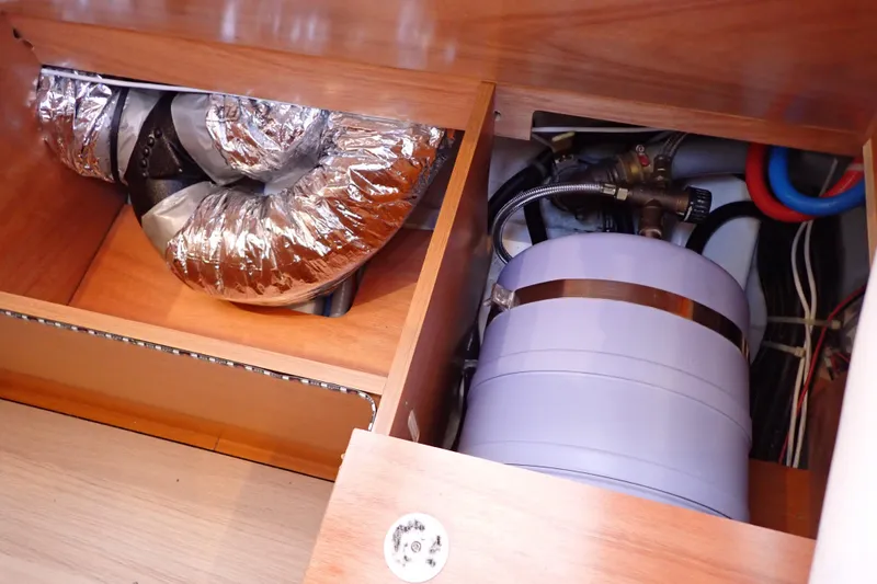 Slide: The Image of Interior view of 2018 Jeanneau Sun Odyssey 389 yacht's mechanical components and ductwork. - 137