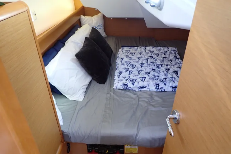 Slide: The Image of Cozy cabin interior of 2018 Jeanneau Sun Odyssey 389 sailboat with comfortable bedding. - 14