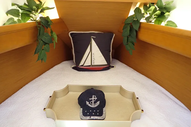 Slide: The Image of Cozy cabin interior of 2018 Jeanneau Sun Odyssey 389 with nautical decor and plants. - 146