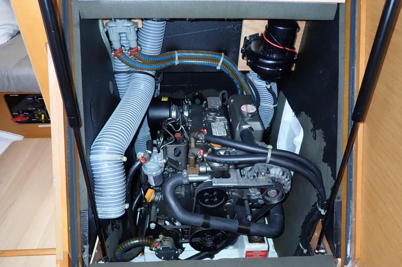Slide: The Image of Engine compartment of a 2018 Jeanneau Sun Odyssey 389 sailboat, showcasing mechanical components. - 16