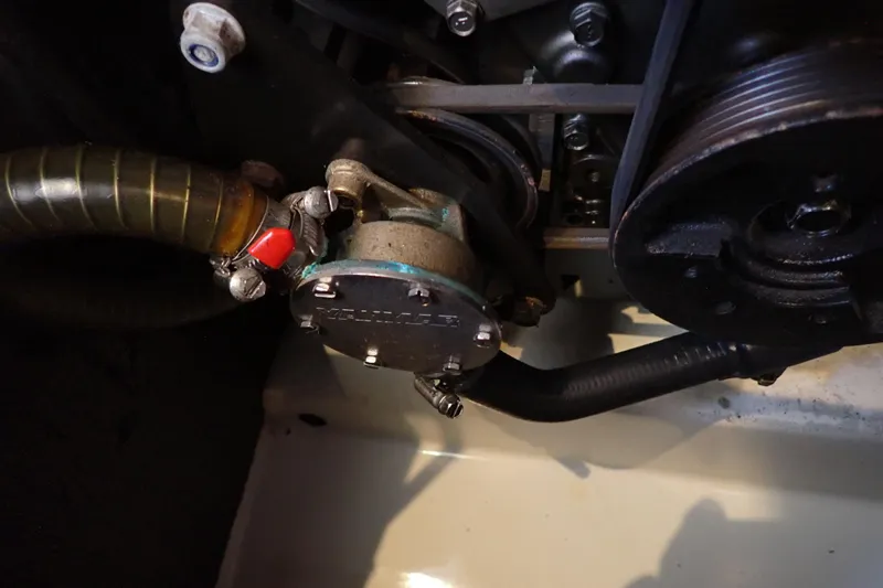 Slide: The Image of Engine component of 2018 Jeanneau Sun Odyssey 389 sailboat, featuring hoses and pulleys. - 162