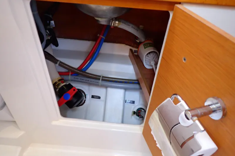 Slide: The Image of Interior plumbing of 2018 Jeanneau Sun Odyssey 389 sailboat, showing pipes and fittings. - 173