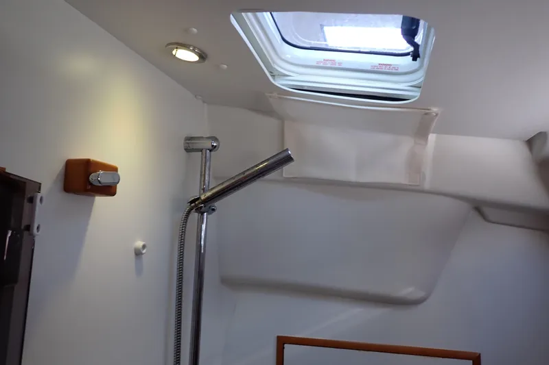 Slide: The Image of Interior of 2018 Jeanneau Sun Odyssey 389 yacht, featuring a shower and skylight. - 176