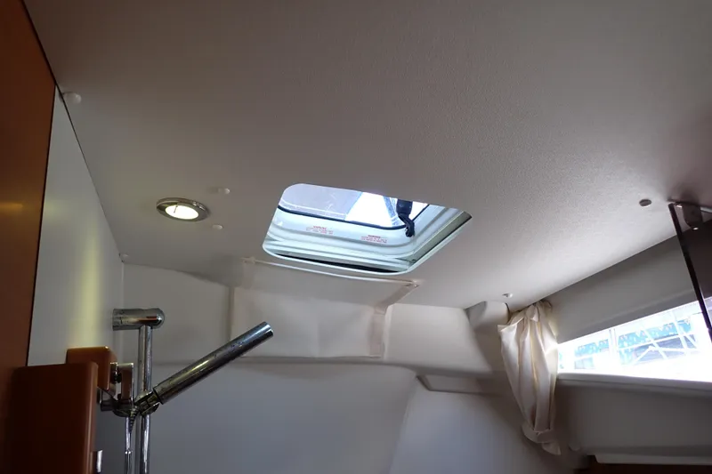 Slide: The Image of Interior of 2018 Jeanneau Sun Odyssey 389 yacht with open ceiling hatch. - 187