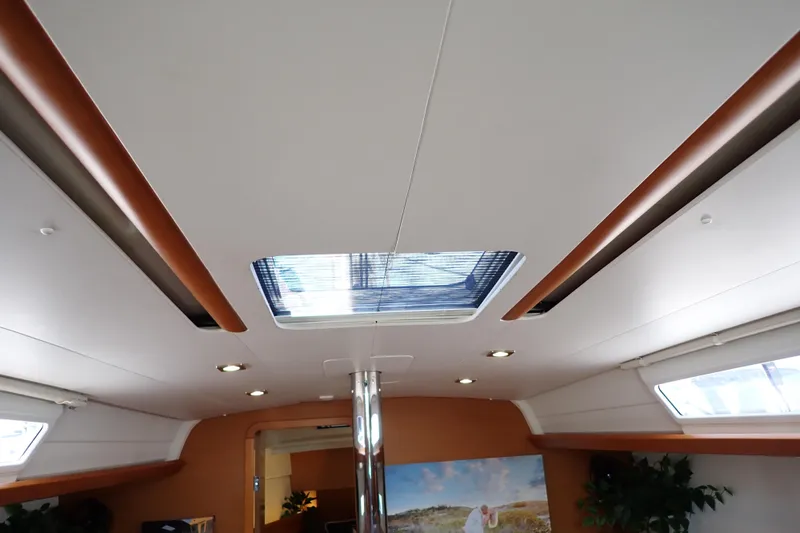 Slide: The Image of Interior ceiling of 2018 Jeanneau Sun Odyssey 389 sailboat with skylight and recessed lighting. - 189