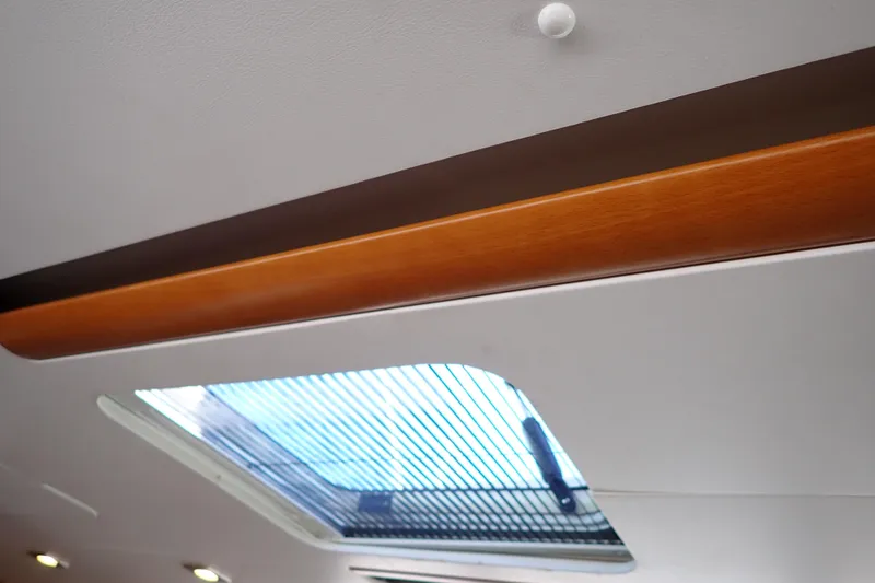 Slide: The Image of Interior view of 2018 Jeanneau Sun Odyssey 389 yacht skylight and wooden trim. - 191