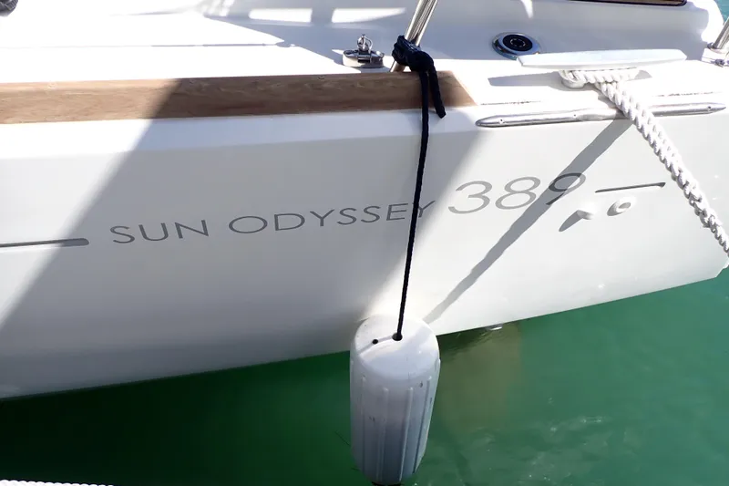 Slide: The Image of 2018 Jeanneau Sun Odyssey 389 sailboat docked with fender and rope. - 195