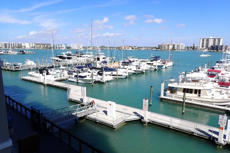 Slide: The Image of Marina with Jeanneau Sun Odyssey 389 sailboats, 2018 model, docked under clear blue skies. - 198
