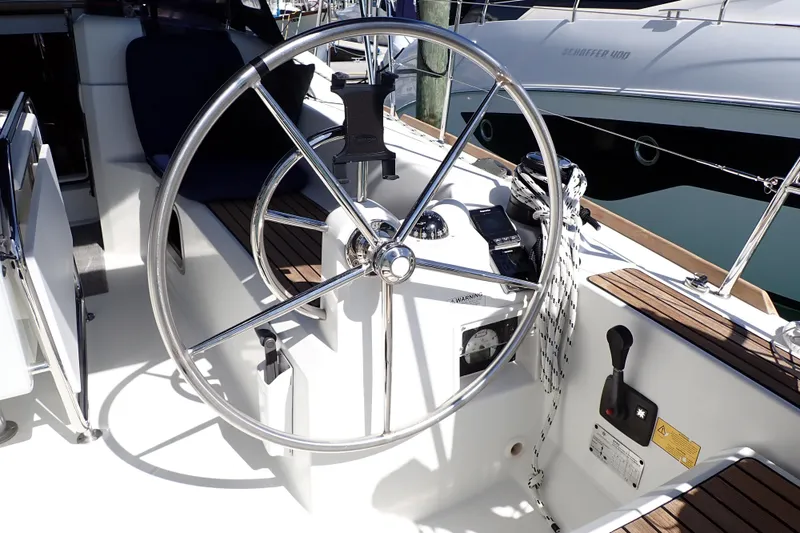 Slide: The Image of Steering wheel of a 2018 Jeanneau Sun Odyssey 389 sailboat in a marina. - 20