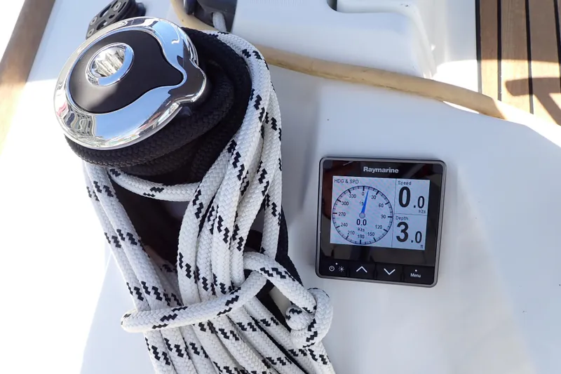 Slide: The Image of 2018 Jeanneau Sun Odyssey 389 sailboat with Raymarine display and coiled rope on deck. - 22