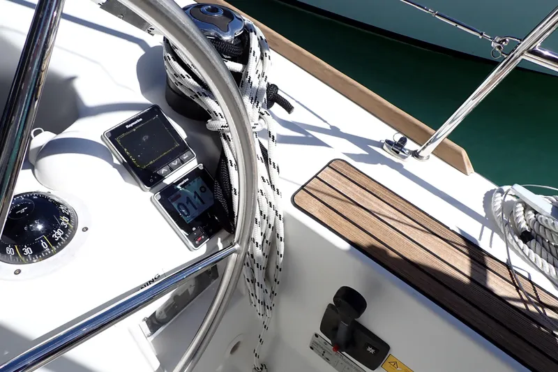 Slide: The Image of Cockpit of 2018 Jeanneau Sun Odyssey 389 sailboat with navigation instruments and compass. - 23