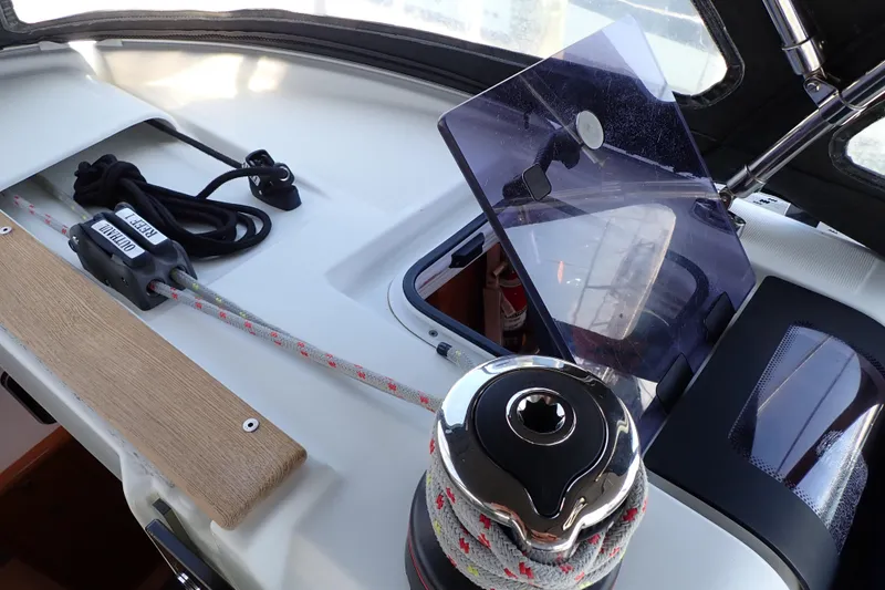 Slide: The Image of Cockpit view of 2018 Jeanneau Sun Odyssey 389 sailboat with winch and rope details. - 30