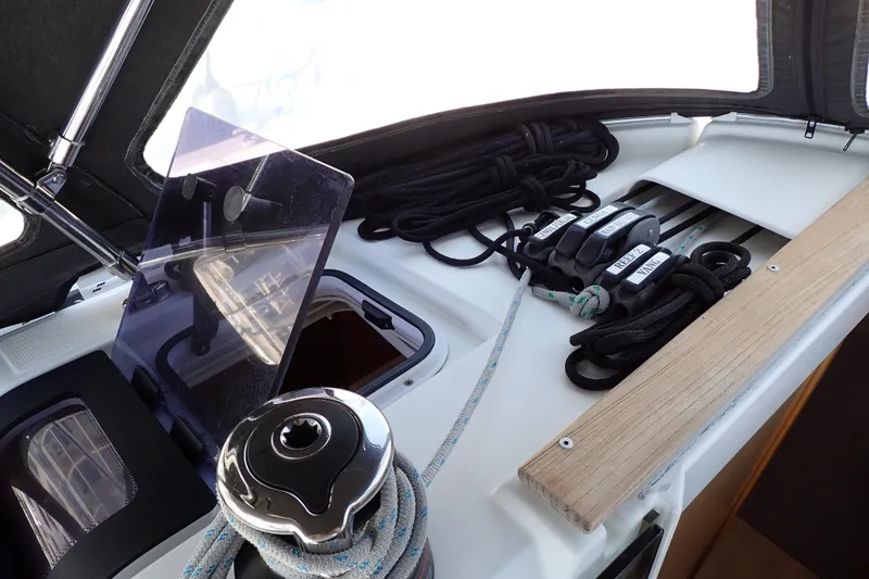 Slide: The Image of 2018 Jeanneau Sun Odyssey 389 sailboat deck with ropes and winch. - 32