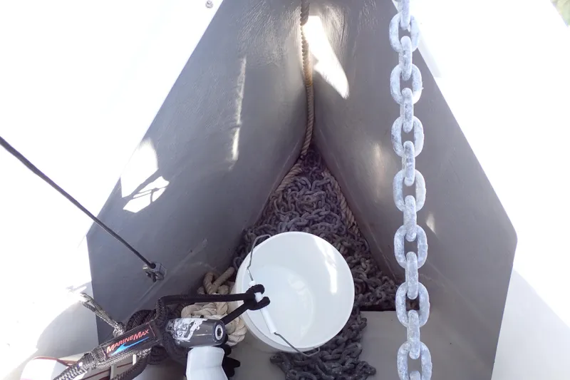 Slide: The Image of Anchor chain locker of 2018 Jeanneau Sun Odyssey 389 sailboat, featuring ropes and marine equipment. - 41