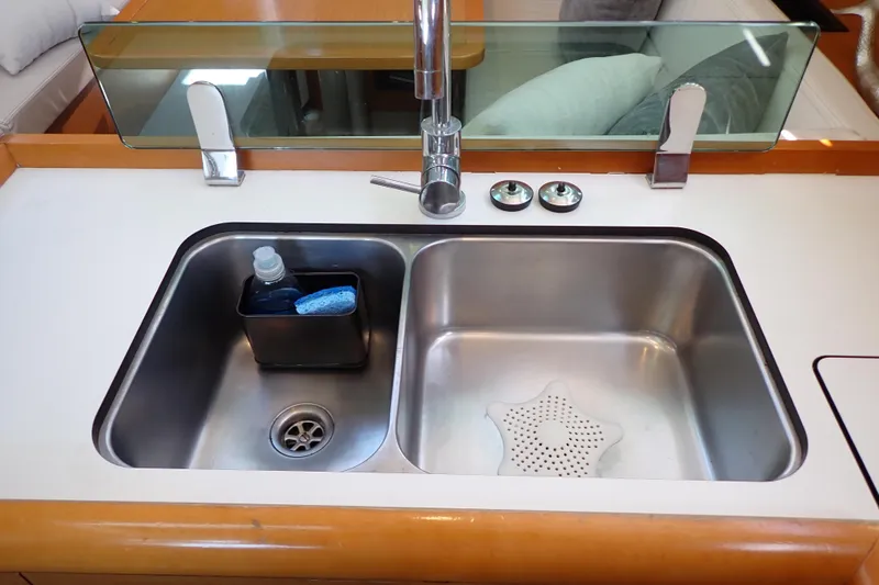 Slide: The Image of Stainless steel sink in 2018 Jeanneau Sun Odyssey 389 yacht kitchen. - 50