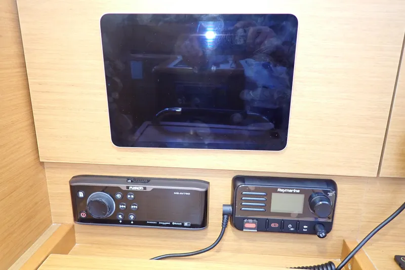 Slide: The Image of Control panel of 2018 Jeanneau Sun Odyssey 389 with navigation and audio systems. - 51