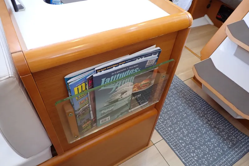 Slide: The Image of Interior of 2018 Jeanneau Sun Odyssey 389 with magazine rack and wooden finish. - 53