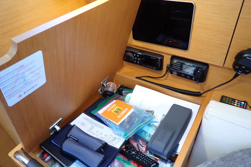 Slide: The Image of Interior of 2018 Jeanneau Sun Odyssey 389 with navigation equipment and storage compartment. - 54