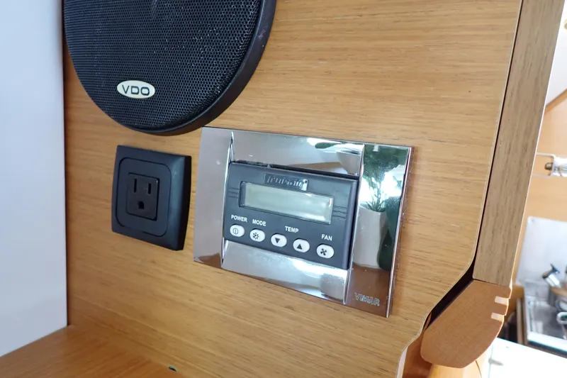 Slide: The Image of Control panel and speaker on 2018 Jeanneau Sun Odyssey 389 yacht interior. - 58