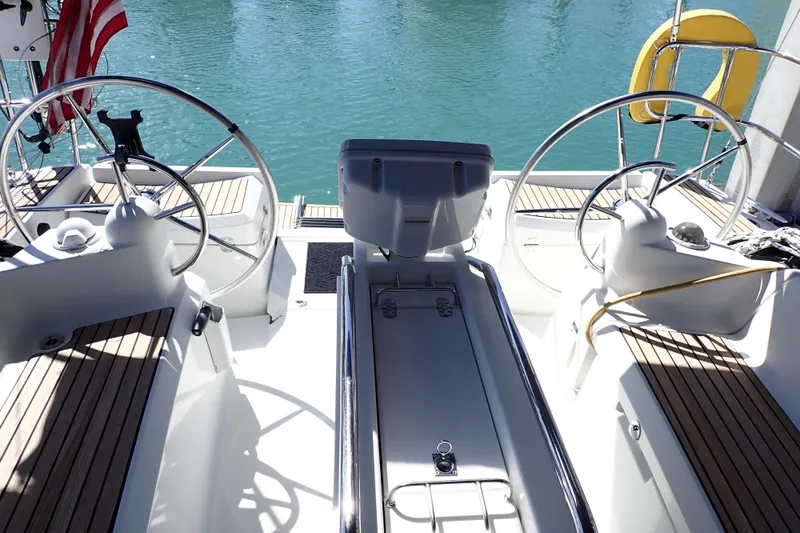 Slide: The Image of Cockpit of 2018 Jeanneau Sun Odyssey 389 sailboat with dual steering wheels. - 6