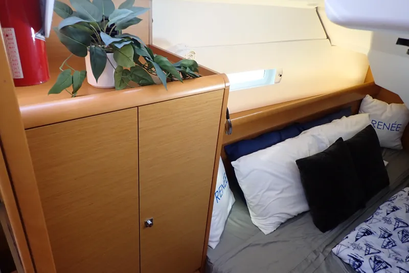 Slide: The Image of Cozy cabin interior of 2018 Jeanneau Sun Odyssey 389 with plants and pillows. - 63