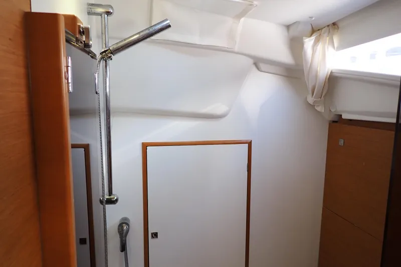 Slide: The Image of Interior of 2018 Jeanneau Sun Odyssey 389 yacht, featuring a compact shower area. - 70