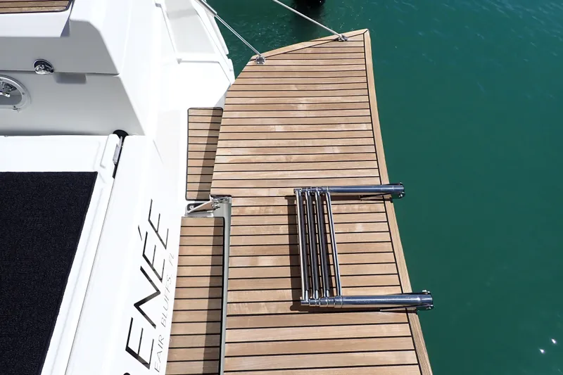 Slide: The Image of Teak swim platform on 2018 Jeanneau Sun Odyssey 389 yacht, featuring a foldable ladder. - 73