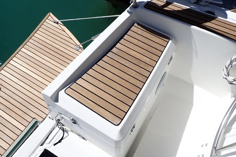 Slide: The Image of 2018 Jeanneau Sun Odyssey 389 deck with teak finish and seating area. - 76