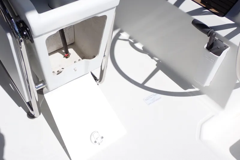 Slide: The Image of 2018 Jeanneau Sun Odyssey 389 cockpit detail with open compartment and steering wheel. - 85