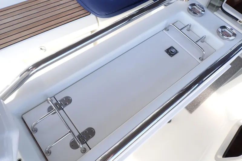 Slide: The Image of Cockpit storage area on 2018 Jeanneau Sun Odyssey 389 sailboat. - 86