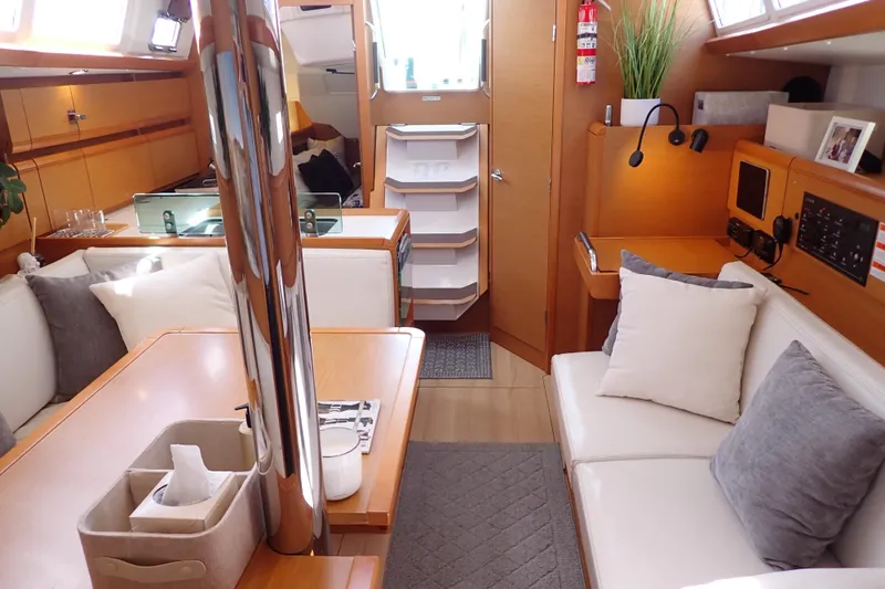 Slide: The Image of Interior of 2018 Jeanneau Sun Odyssey 389 sailboat, featuring cozy seating and modern design. - 9