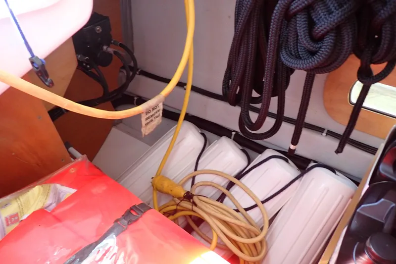 Slide: The Image of Interior of 2018 Jeanneau Sun Odyssey 389 with ropes, cables, and fenders. - 92