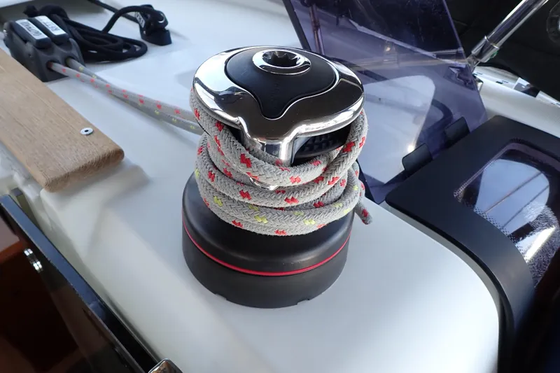 Slide: The Image of Winch with rope on 2018 Jeanneau Sun Odyssey 389 sailboat deck. - 97