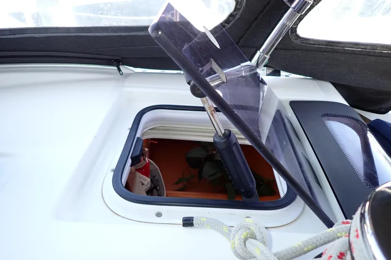 Slide: The Image of Open hatch on 2018 Jeanneau Sun Odyssey 389 sailboat deck, showing interior view. - 98