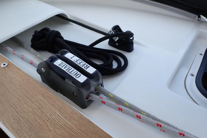 Slide: The Image of 2018 Jeanneau Sun Odyssey 389 sailboat deck with ropes and cleats. - 99