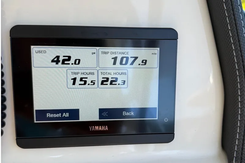 Slide: The Image of Yamaha display showing fuel usage and trip data on 2023 Grady-White Freedom 235 boat. - 11