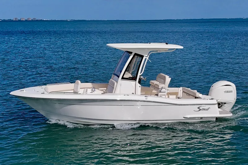 Slide: The Image of 2026 Scout 220 XSF boat cruising on clear blue water. - 23