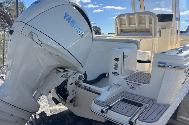 Slide: The Image of 2026 Scout 220 XSF boat with Yamaha outboard motor, featuring a sleek deck design. - 3