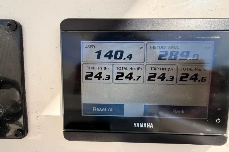 Slide: The Image of Display screen showing fuel usage and trip data for 2024 Cobia 262 Center Console. - 22